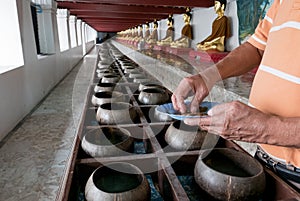 Buddhists are donating money to temple by their faith and to maintain the temple in Thailand.