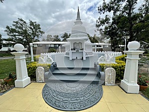 Buddies temple in forest lake with moonstone photo