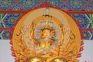 Buddism godness Guanyin statue in the hall in a temple photo