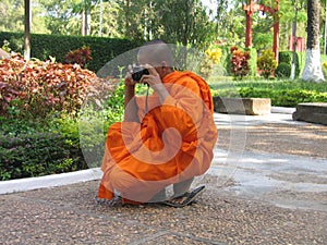 Buddist monk with a camera
