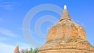 Buddist Stupa ancient red brick monument on a blue clear sky background