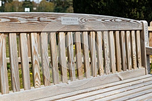 A buddy bench where friends or strangers can sit for a conversation and companionship. Friendship, loneliness, mental health