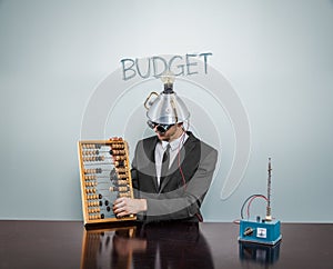 Budg et -VB man- text on blackboard with businessman