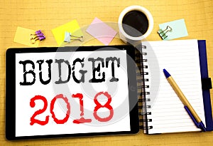 Budget 2018. Business concept for Household budgeting accounting planning Written on tablet laptop, wooden background with sticky