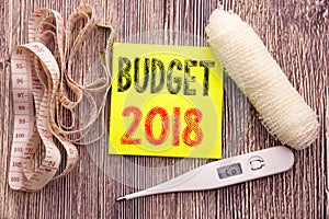 Budget 2018. Business fitness health concept for Household budgeting accounting planning written sticky note empty paper backgroun