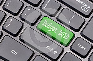 Budget 2019 on green enter key, of a black keyboard.