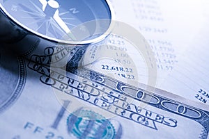 Budget, dollars and compass