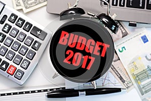 Budget exercise or forecast for the upcoming year of 2017 concept with old clock