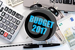 Budget exercise or forecast for the upcoming year 2017 with vintage clock with black display concept