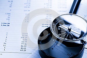 Budget, magnifying glass and black compass