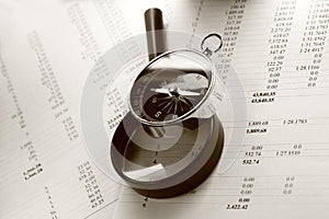 Budget, magnifying glass and compass