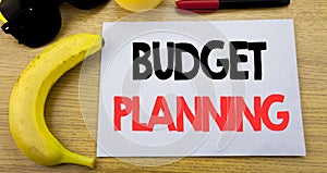 Budget Planning. Business concept for Financial Budgeting written on sticky note empty paper, wooden background with copy space, s