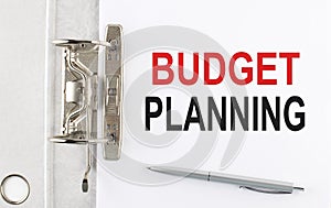 BUDGET PLANNING text on paper folder with pen. Business concept