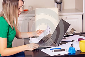 budget planning - woman at home planning family budget and finances..