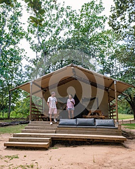 Budget Safarin tent in South Africa for families vacations, couple man and woman camping safari tent