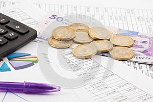 Budget spreadsheet, money, pen and calculator