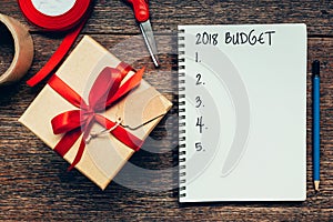 2018 Budget text on notebook paper with gift box photo
