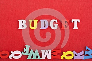 BUDGET word on red background composed from colorful abc alphabet block wooden letters, copy space for ad text. Learning english