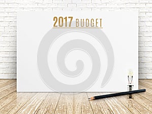 2017 budget year text on white paper poster with black pencil an
