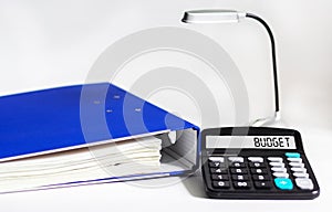 Budgeting and budget calculation or analysis. Word budget on calculator and white background