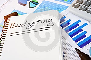 Budgeting written in notepad. Budget concept. photo