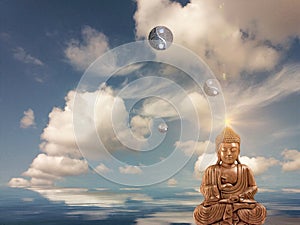 Budha meditating in sea reflection