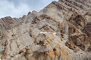 A Budha statue of a Tibetan traditional  temple near the Hemis monastery built at the hillside of barren mountains in Leh, Ladakh