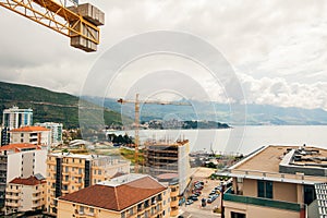 Budva building construction. Construction crane high-rise buildi