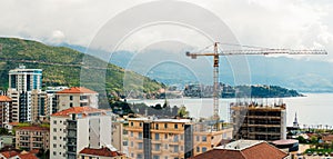 Budva building construction. Construction crane high-rise buildi