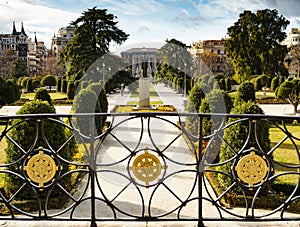 Stunning view of Buen Retiro Park, with Parterre gardens, Felipe IV gate and pavillon of Prado Museum in background, Madrid, Spain photo