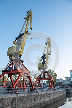 Old port cranes in the financial district of Puerto Madero in the capital of Argentina, Buenos Aires in 2023