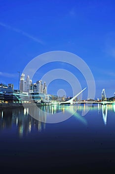 Buenos Aires Puerto Madero modern city with skyscrapers at night and Darcena Puente de la Mujer Argentina