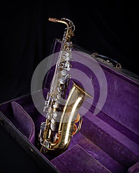 Buescher Alto Sax, Gold Lacquered in Deep Purple Velvet-Lined Hard Case side 1