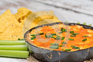 Buffalo chicken dip with chps and celery