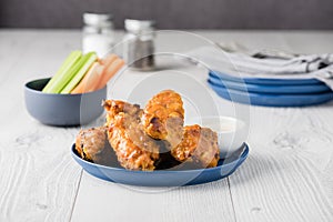 Buffalo chicken wings with celery carrot sticks