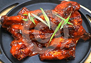 Buffalo chicken wings in a metal plate