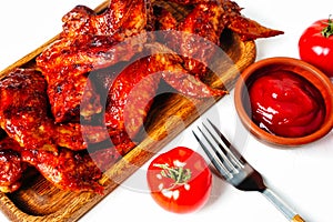 Buffalo grilled chicken wing with tomato pepper sauce isolated on white background