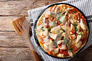 Buffalo pizza with chicken breast, tomato concasse and cheese cl