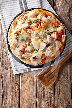 Buffalo pizza with chicken breast, tomato concasse and cheese cl photo