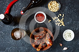 Buffalo style chicken wings served with cold beer