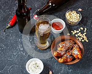 Buffalo style chicken wings served with cold beer