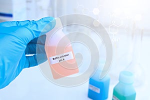 Buffer solution in glass, chemical in the laboratory and industry