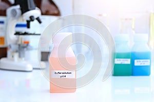 Buffer solution in glass, chemical in the laboratory and industry