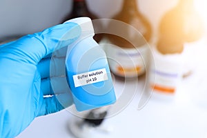 Buffer solution in glass, chemical in the laboratory and industry