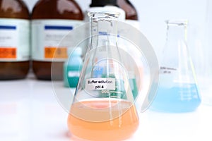 Buffer solution in glass, chemical in the laboratory and industry
