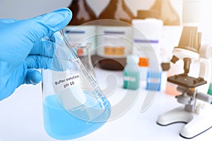 Buffer solution in glass, chemical in the laboratory and industry