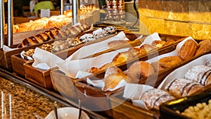 Buffet breakfast in luxury hotel with fresh pastry, donuts and bakery