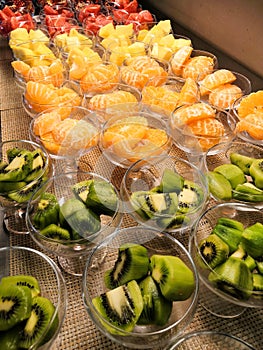 Buffet, fruit platter tangerine, pineapple, grapefruit, kiwi