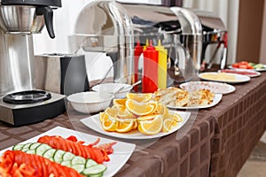 Buffet heated trays ready for service. Breakfast in hotel smorgasbord.