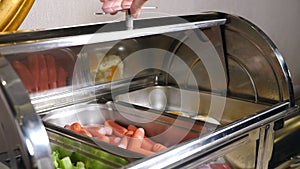 Buffet heated trays with sausages, boiled broccoli and fried eggs in hotel luxury restaurant. All inclusive. Buffet food